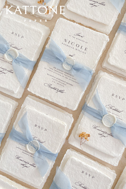 Announce your special day with understated elegance and personal charm. This earthen neutral wedding stationery collection is crafted to celebrate your love story with a refined, organic feel. Each invitation is a personalised handmade invite, featuring your unique details on our premium, artisan paper. The soft, neutral tones create a timeless and tranquil aesthetic, perfectly complemented by the gentle hue of the "Light Sky" accent color.
