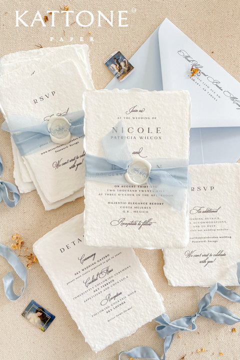 Announce your special day with understated elegance and personal charm. This earthen neutral wedding stationery collection is crafted to celebrate your love story with a refined, organic feel. Each invitation is a personalised handmade invite, featuring your unique details on our premium, artisan paper. The soft, neutral tones create a timeless and tranquil aesthetic, perfectly complemented by the gentle hue of the "Light Sky" accent color.