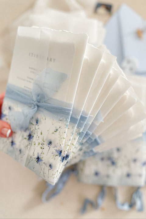 Evoke a sense of travel and fine artistry with this luxurious wedding invitation set from Kattone. Perfect for a destination wedding, this suite combines the tactile beauty of artisan handmade paper with a one-of-a-kind, hand-drawn custom venue illustration. The result is a truly bespoke, fine art keepsake that will beautifully announce your special celebration to your guests.