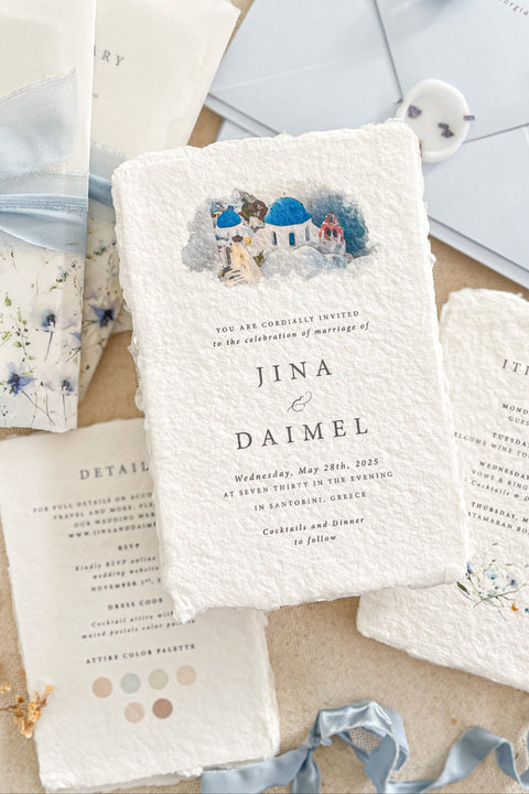 Evoke a sense of travel and fine artistry with this luxurious wedding invitation set from Kattone. Perfect for a destination wedding, this suite combines the tactile beauty of artisan handmade paper with a one-of-a-kind, hand-drawn custom venue illustration. The result is a truly bespoke, fine art keepsake that will beautifully announce your special celebration to your guests.