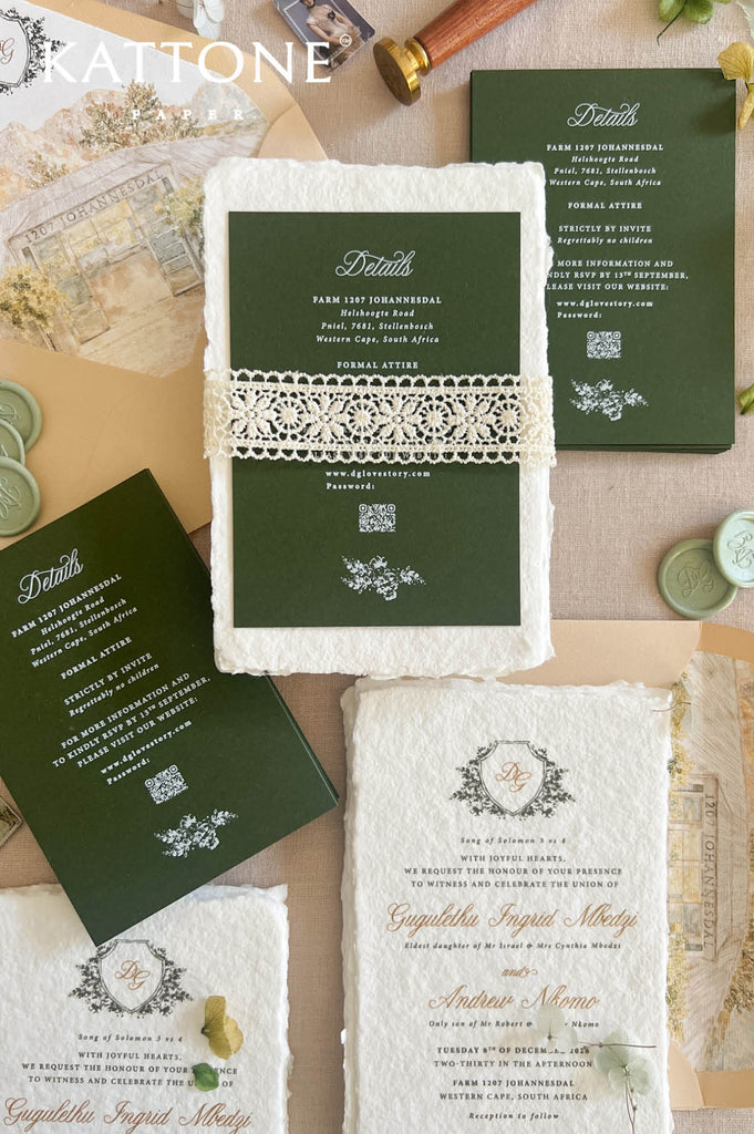 A styled flat-lay of a wedding invitation suite from Rattone, featuring dark green paper inserts, cream lace trim, and textured cream paper cards with elegant typography, arranged on a beige surface with vintage props.