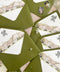 Top-down close-up of olive green wedding envelopes with custom watercolor country club venue liners, featuring an elegant estate building, red awnings, landscaped greenery, and black personalized monogram