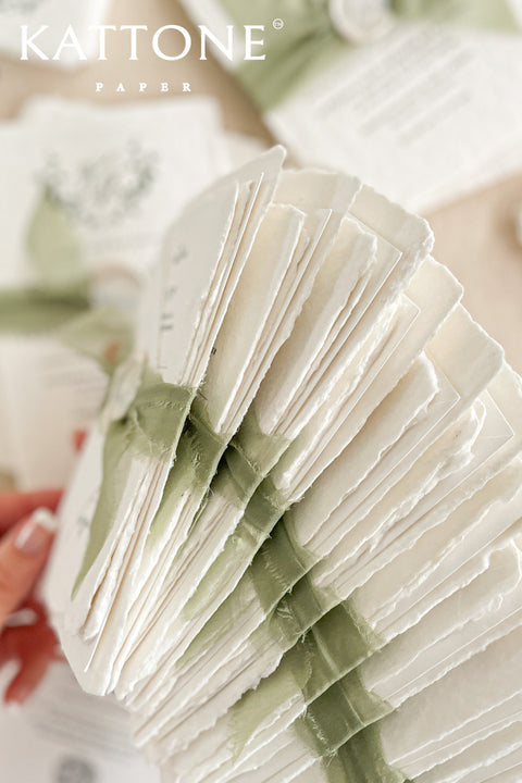 Enhance your special day with our exquisite Wedding Invitations featuring stunning silk ribbons and wax seals. Each invite is crafted on beautiful handmade deckled edge paper, adding a touch of elegance to your celebrations. Our customizable designs ensure that your unique love story shines through. Contact us for a personalized quote.