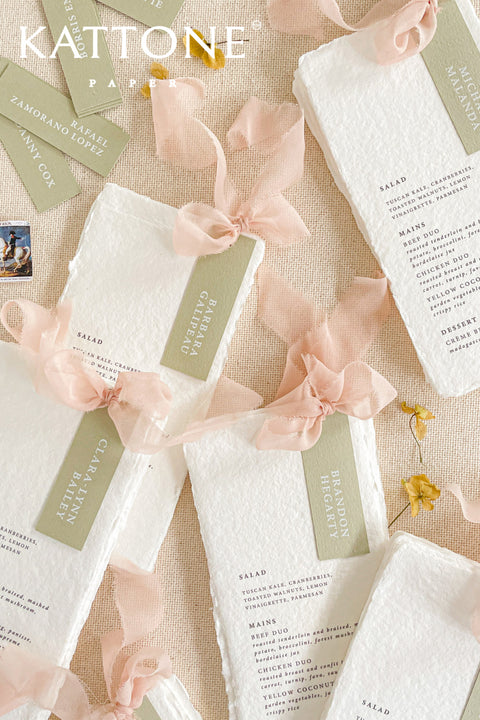 Introduce modern simplicity to your event with our place cards, crafted from premium cardstock in a soft sage color and printed with clean, contemporary typography. Their slim tag-style silhouette offers a fresh, minimalist look perfect for weddings, rehearsal dinners, corporate gatherings, or garden-inspired celebrations. These versatile cards can be displayed on napkins, tied with ribbon, or layered with menus for a refined and cohesive tablescape.