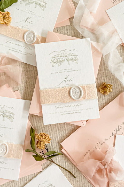 Announce your celebration with timeless elegance through our custom illustrated Save the Date cards, featuring a hand-drawn watercolor or line sketch of your wedding venue. Each card is printed on premium textured cotton paper and paired with soft blush envelopes, vellum wraps, and a white wax seal, creating a refined and romantic presentation.