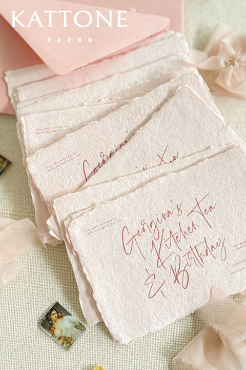 Colored handmade paper bridal shower invitations bring a soft, romantic warmth to your celebration. Crafted from artisan paper with beautifully deckled edges, each invitation features a gentle blush tone and modern handwritten-style typography for an effortlessly elegant look. The tactile texture and subtle color elevate the design, making these invitations perfect for bridal showers, garden parties, tea celebrations, and feminine gatherings that feel both personal and refined.