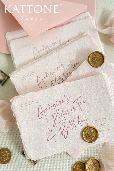 Colored handmade paper bridal shower invitations bring a soft, romantic warmth to your celebration. Crafted from artisan paper with beautifully deckled edges, each invitation features a gentle blush tone and modern handwritten-style typography for an effortlessly elegant look. The tactile texture and subtle color elevate the design, making these invitations perfect for bridal showers, garden parties, tea celebrations, and feminine gatherings that feel both personal and refined.