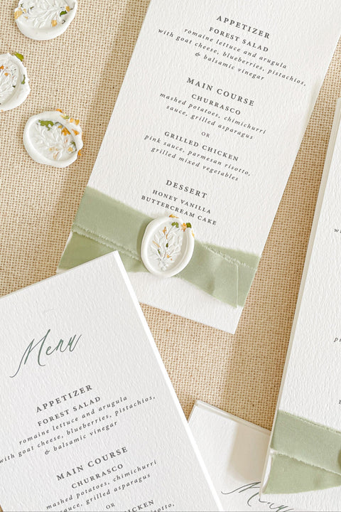 Elevate your reception with our luxury wedding menus, featuring velvet ribbon detailing and elegant wax seals. Crafted on premium textured cardstock with refined typography, these menus exude timeless sophistication and charm. Perfect for romantic, fine-art, and garden weddings, each piece adds an artisanal touch to your tablescape - where design meets elegance.