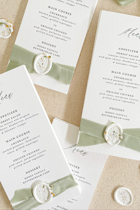Elevate your reception with our luxury wedding menus, featuring velvet ribbon detailing and elegant wax seals. Crafted on premium textured cardstock with refined typography, these menus exude timeless sophistication and charm. Perfect for romantic, fine-art, and garden weddings, each piece adds an artisanal touch to your tablescape - where design meets elegance.