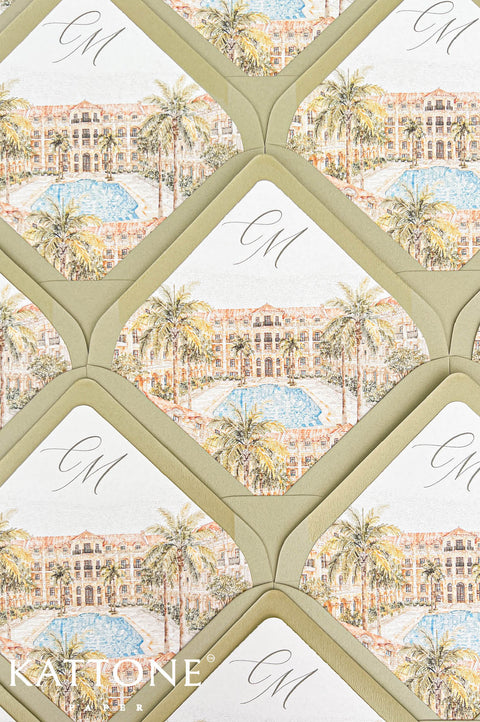 Top-down close-up of sage green wedding envelopes with custom watercolor envelope liners featuring tropical architecture, palm trees, blue pool scenery, and elegant monogram initials