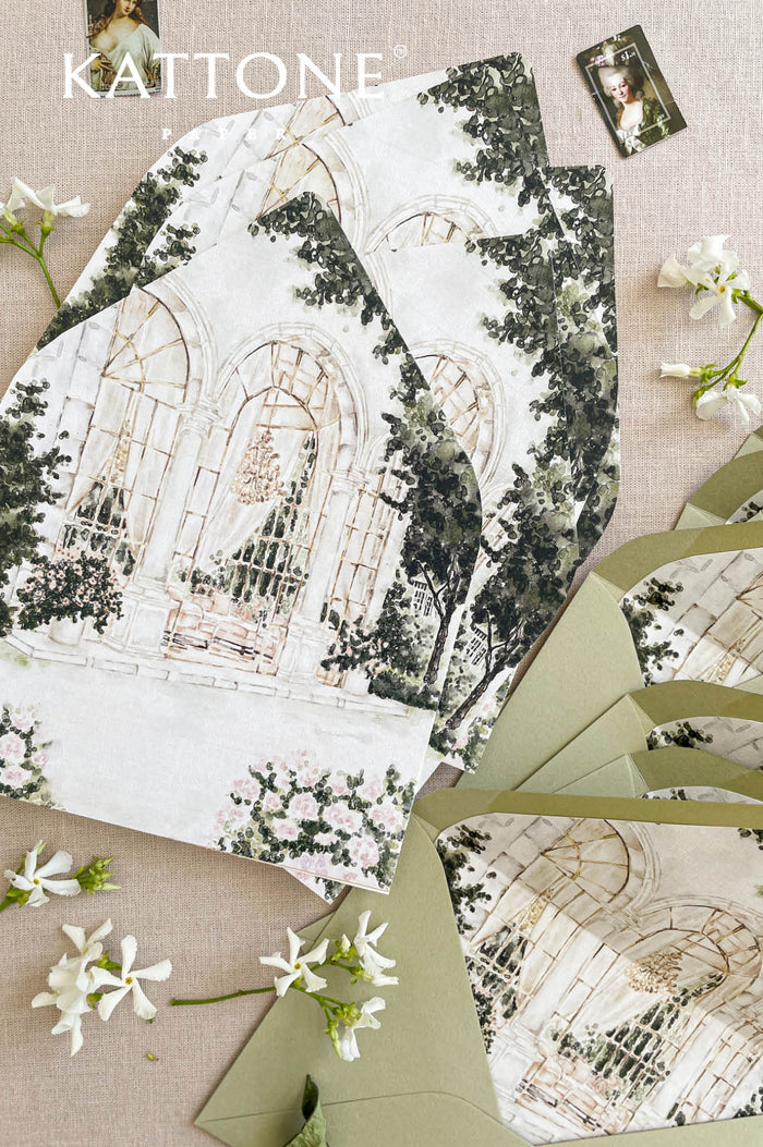 Wedding envelopes with custom watercolor envelope liners featuring a hand-painted architectural venue illustration with soft greenery and romantic detailing.