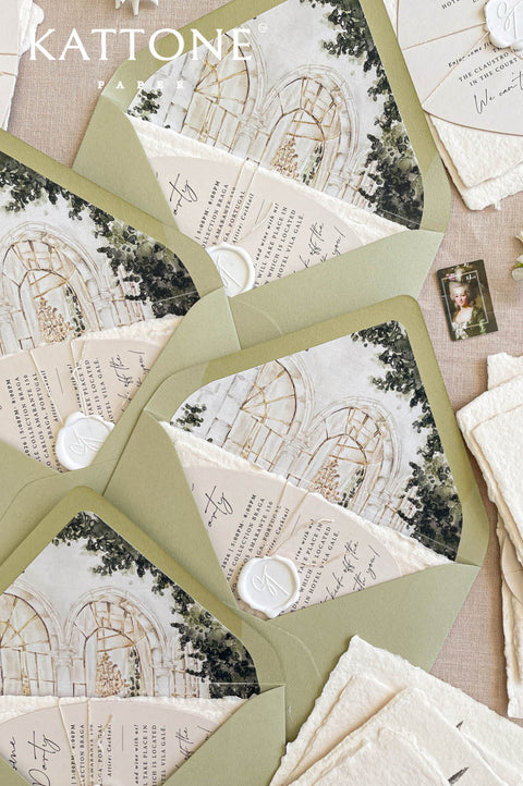 Stacked luxury wedding envelopes revealing hand-painted venue illustration liners with architectural details and greenery accents.