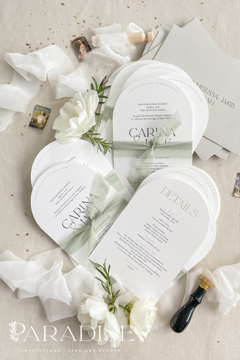 Our arched wedding invitation suite is perfect for couples seeking a modern yet romantic stationery style. The smooth arch shape brings a contemporary edge, while the sage green silk ribbon adds a soft, botanical touch. Printed on premium white matte cardstock, this suite features clean, modern typography and delicate detailing that beautifully complements any wedding theme - from garden to destination to modern minimalist celebrations.
