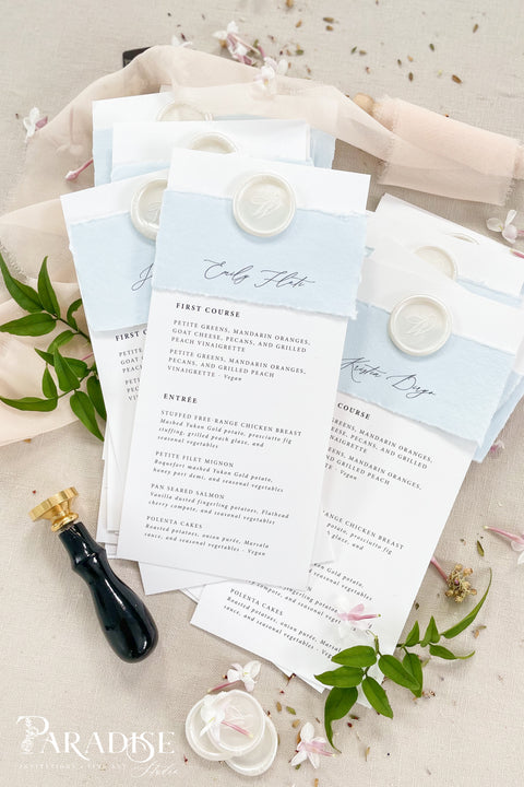 Elevate your table setting with our handmade paper wedding menus with personalized name tags, designed to merge fine-art elegance and functionality. Crafted on luxury cotton paper with a soft deckled edge, each menu features a hand-torn band and custom wax seal that doubles as a keepsake place card. The subtle dusty blue tones add a refined, romantic touch to coastal, garden, or destination weddings.