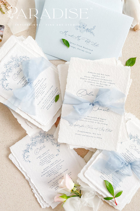 Announce your special day with timeless, heartfelt style. This botanical wedding invitation suite is crafted on our signature, luxurious handmade paper, made from 100% recycled cotton rag. The unique deckled edges and soft texture provide an artisan feel that is both rustic and elegant, setting a deeply romantic tone for your ceremony. Featuring delicate botanical illustrations, each invite is an eco-friendly choice that leaves a lasting impression on your guests.
