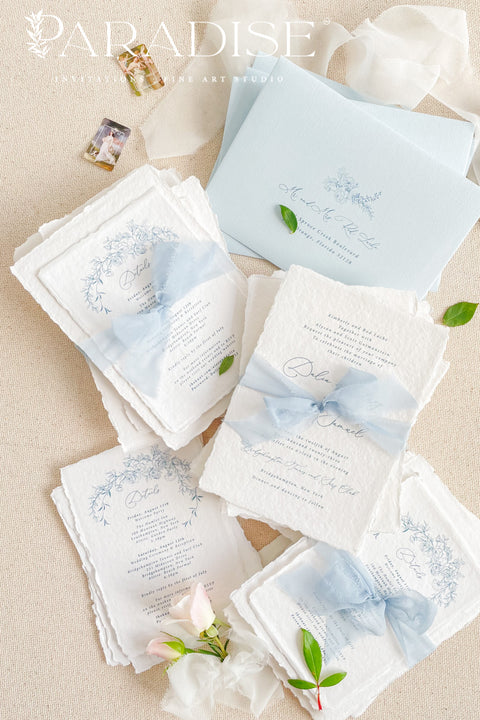 Announce your special day with timeless, heartfelt style. This botanical wedding invitation suite is crafted on our signature, luxurious handmade paper, made from 100% recycled cotton rag. The unique deckled edges and soft texture provide an artisan feel that is both rustic and elegant, setting a deeply romantic tone for your ceremony. Featuring delicate botanical illustrations, each invite is an eco-friendly choice that leaves a lasting impression on your guests.