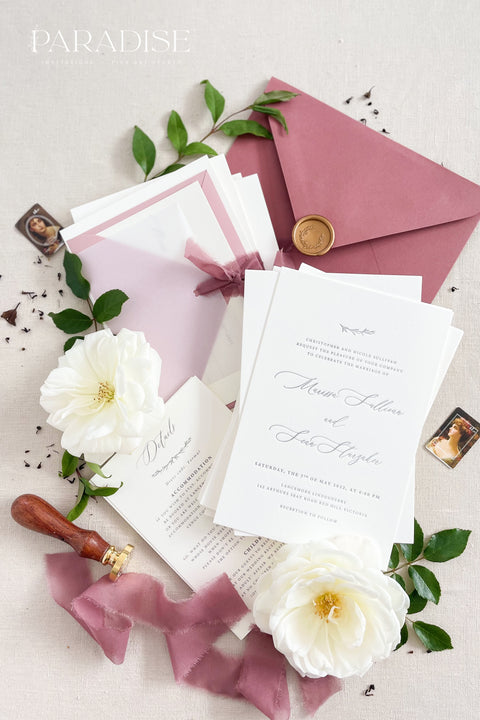 This wedding invitation suite exudes timeless romance and refined modernity, perfect for couples who love soft luxury and intentional design. Wrapped in delicate vellum jackets and tied with rich burgundy silk ribbons, each invitation feels like an elegant love letter - graceful, textured, and unforgettable. Printed on luxury fine art cardstock, the minimalist typography and spacious layout create a beautifully balanced aesthetic that feels both modern and classic.