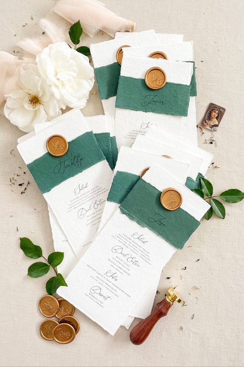 Elevate your wedding tablescape with our luxury handmade wedding menus, featuring deckled edges, silk paper belly bands, and wax seal accents. Each piece is crafted on fine cotton rag paper to create a timeless balance between elegance and texture - perfect for romantic, classic, or fine art celebrations. These menus blend craftsmanship and sophistication, turning every place setting into an unforgettable detail of your special day.