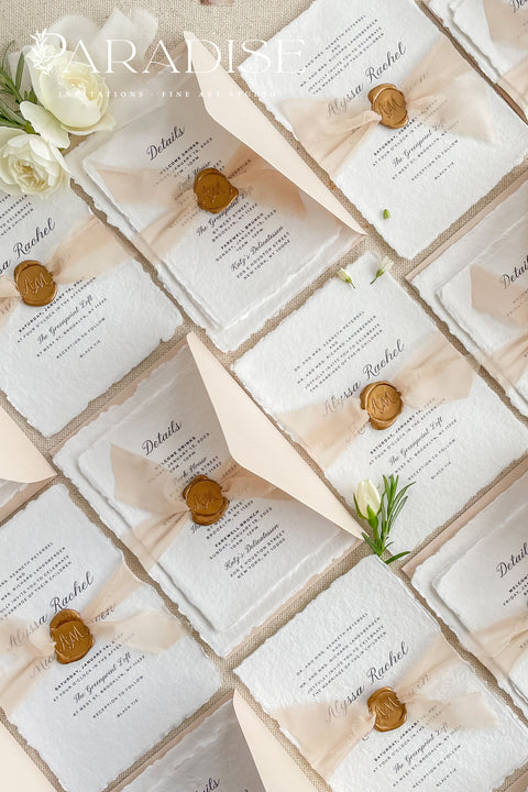 Announce your love story with timeless elegance through our&nbsp;handmade deckled-edge wedding invitations, beautifully detailed with soft blush tones, sheer ribbon, and custom wax seals. Each invitation is carefully crafted by hand using premium cotton paper for a naturally textured, fine art finish that embodies romance and sophistication.