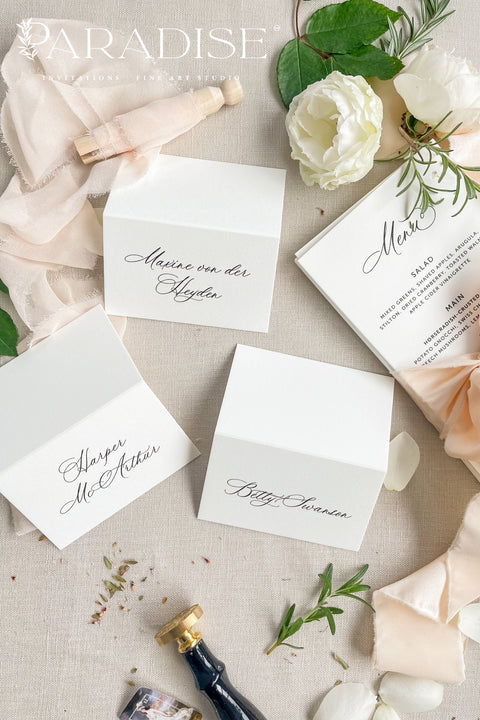 Elevate your event with our refined place cards, crafted from premium cardstock and designed with elegant handwritten-style calligraphy. Their crisp, minimalist look makes them perfect for weddings, rehearsal dinners, galas, and sophisticated gatherings. With a clean folded silhouette and timeless aesthetic, these place cards bring effortless beauty, clarity, and polished charm to any seating display.
