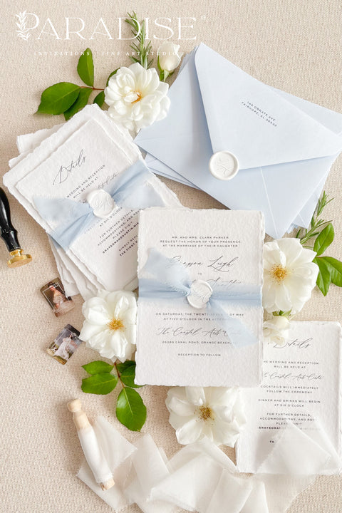 This exquisite invitation sets suite offers a blend of modern sophistication and natural beauty. Perfect for a beach wedding, these personalised invites feature a stunning, modern clean calligraphy design printed on luxurious handmade cotton paper. The tactile, rich feel of the paper beautifully complements the elegant and contemporary typography, setting a fresh and personal tone for your special day.