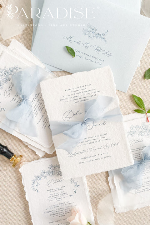 Announce your special day with timeless, heartfelt style. This botanical wedding invitation suite is crafted on our signature, luxurious handmade paper, made from 100% recycled cotton rag. The unique deckled edges and soft texture provide an artisan feel that is both rustic and elegant, setting a deeply romantic tone for your ceremony. Featuring delicate botanical illustrations, each invite is an eco-friendly choice that leaves a lasting impression on your guests.