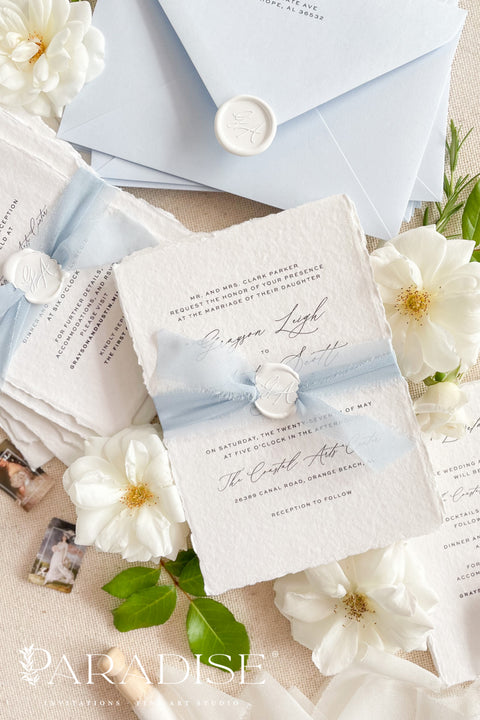 This exquisite invitation sets suite offers a blend of modern sophistication and natural beauty. Perfect for a beach wedding, these personalised invites feature a stunning, modern clean calligraphy design printed on luxurious handmade cotton paper. The tactile, rich feel of the paper beautifully complements the elegant and contemporary typography, setting a fresh and personal tone for your special day.