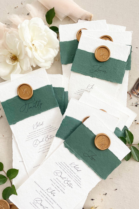 Elevate your wedding tablescape with our luxury handmade wedding menus, featuring deckled edges, silk paper belly bands, and wax seal accents. Each piece is crafted on fine cotton rag paper to create a timeless balance between elegance and texture - perfect for romantic, classic, or fine art celebrations. These menus blend craftsmanship and sophistication, turning every place setting into an unforgettable detail of your special day.