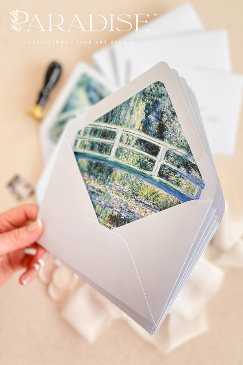 Close-up of open haze envelope revealing artistic liner with painterly texture and color, highlighting fine-art stationery craftsmanship.