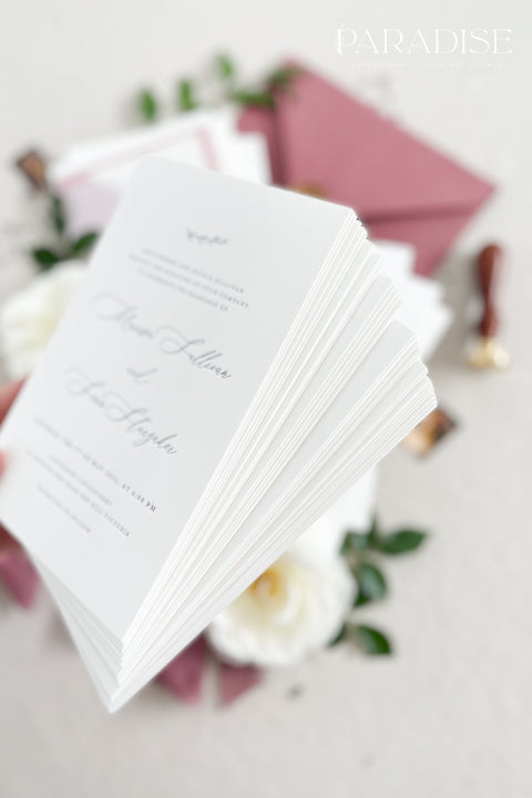 This wedding invitation suite exudes timeless romance and refined modernity, perfect for couples who love soft luxury and intentional design. Wrapped in delicate vellum jackets and tied with rich burgundy silk ribbons, each invitation feels like an elegant love letter - graceful, textured, and unforgettable. Printed on luxury fine art cardstock, the minimalist typography and spacious layout create a beautifully balanced aesthetic that feels both modern and classic.