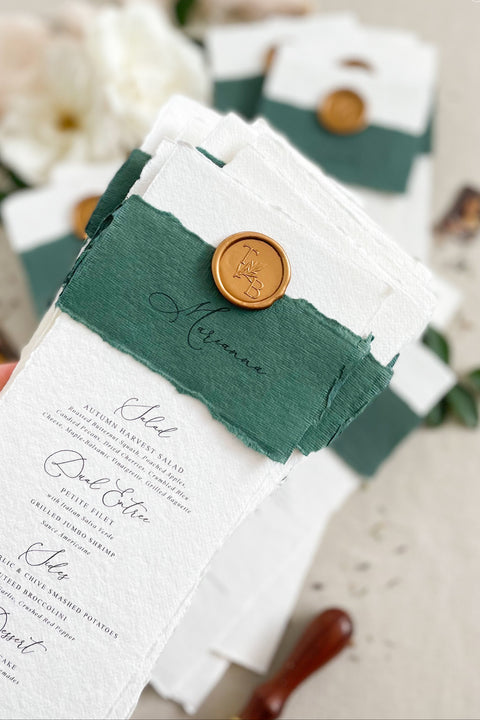Elevate your wedding tablescape with our luxury handmade wedding menus, featuring deckled edges, silk paper belly bands, and wax seal accents. Each piece is crafted on fine cotton rag paper to create a timeless balance between elegance and texture - perfect for romantic, classic, or fine art celebrations. These menus blend craftsmanship and sophistication, turning every place setting into an unforgettable detail of your special day.
