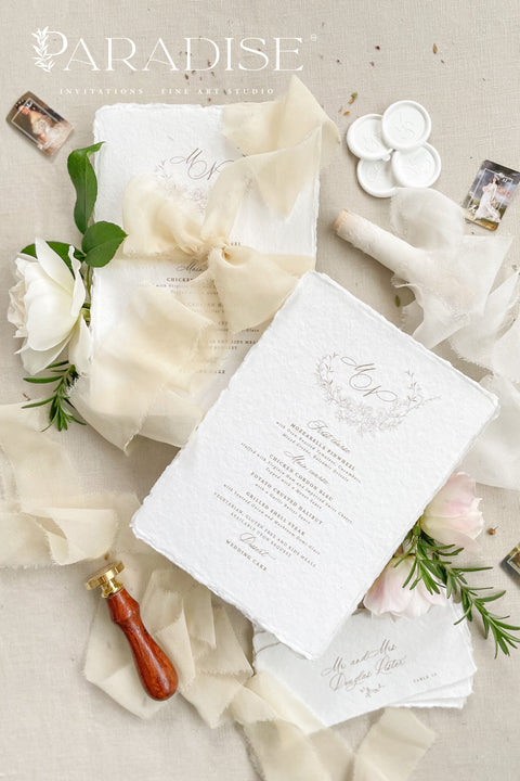 Bring a touch of romantic refinement to your reception with our handmade paper wedding menus, wrapped in soft ivory silk ribbon and finished with an elegant monogram. Each menu is printed on luxury cotton paper with organic deckled edges, embodying effortless sophistication and artisanal charm. Perfect for timeless, fine-art, and garden-inspired weddings. Every detail speaks of craftsmanship, creating an heirloom piece your guests will adore.