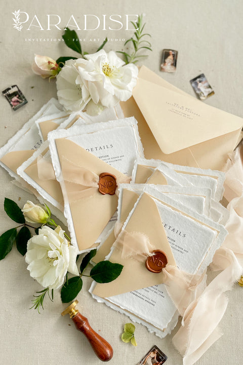 Simple, elegant, and timeless - our handmade wedding invitation suite is crafted from luxury cotton paper with naturally torn deckled edges, giving each piece a soft, organic texture. Paired with beige envelopes, blush silk ribbon, and a classic bronze wax seal, this design captures understated sophistication and effortless romance.
