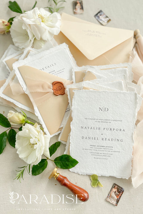 Simple, elegant, and timeless - our handmade wedding invitation suite is crafted from luxury cotton paper with naturally torn deckled edges, giving each piece a soft, organic texture. Paired with beige envelopes, blush silk ribbon, and a classic bronze wax seal, this design captures understated sophistication and effortless romance.