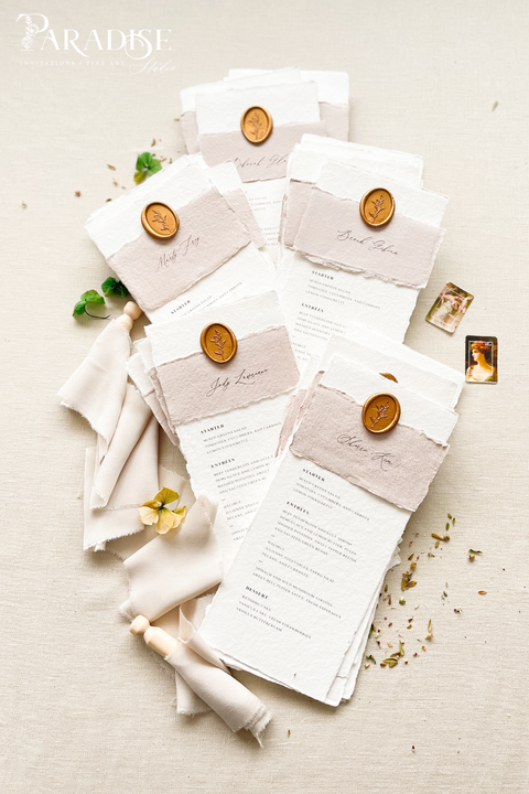 Elevate your reception with our handmade paper wedding menus, featuring taupe silk wraps and gold wax seals for a refined, organic-luxury look. Crafted from 100% cotton paper with deckled edges, these menus capture the essence of fine-art wedding design - romantic, tactile, and timeless. Perfect for elegant garden, rustic, or European-inspired celebrations.