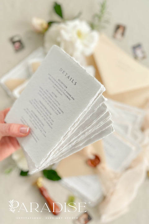 Simple, elegant, and timeless - our handmade wedding invitation suite is crafted from luxury cotton paper with naturally torn deckled edges, giving each piece a soft, organic texture. Paired with beige envelopes, blush silk ribbon, and a classic bronze wax seal, this design captures understated sophistication and effortless romance.