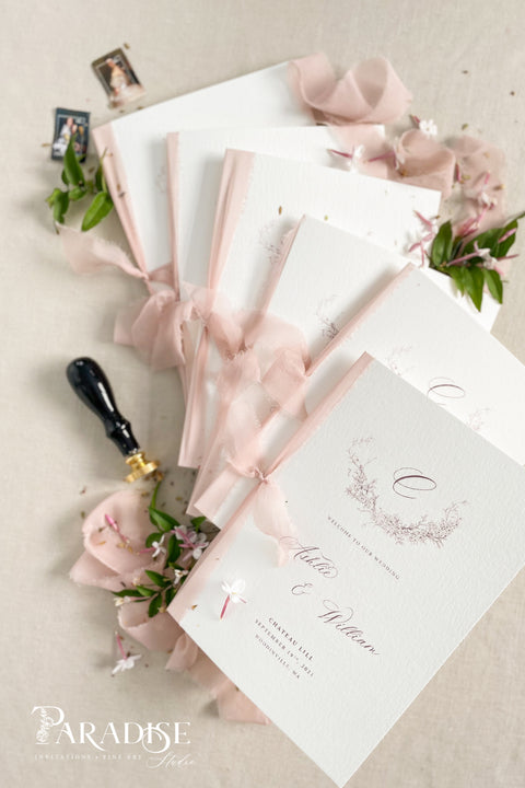 Designed for couples who love soft, feminine details, this wedding program features a gentle blush ribbon, subtle floral artwork, and beautifully balanced typography. The premium paper and delicate monogram create an elevated, cohesive look that enhances your ceremony styling. Thoughtfully crafted to feel both modern and timeless, it offers a graceful introduction to your most meaningful moments.