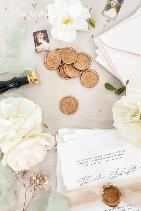 Elegant wax seals designed to elevate your wedding stationery with timeless detail. Each seal is hand-poured and finished to add a refined, heirloom-quality touch to envelopes, invitations, and day-of paper goods. Perfect for couples seeking a classic, romantic aesthetic with artisanal craftsmanship.&nbsp;Ideal for wedding invitations, save the dates, vow books, menus, and keepsake correspondence, these wax seals bring a sense of tradition and luxury to every detail.