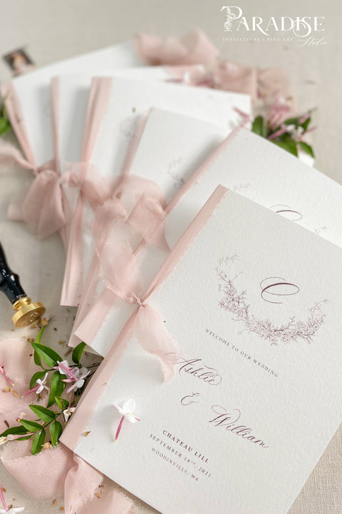 Designed for couples who love soft, feminine details, this wedding program features a gentle blush ribbon, subtle floral artwork, and beautifully balanced typography. The premium paper and delicate monogram create an elevated, cohesive look that enhances your ceremony styling. Thoughtfully crafted to feel both modern and timeless, it offers a graceful introduction to your most meaningful moments.