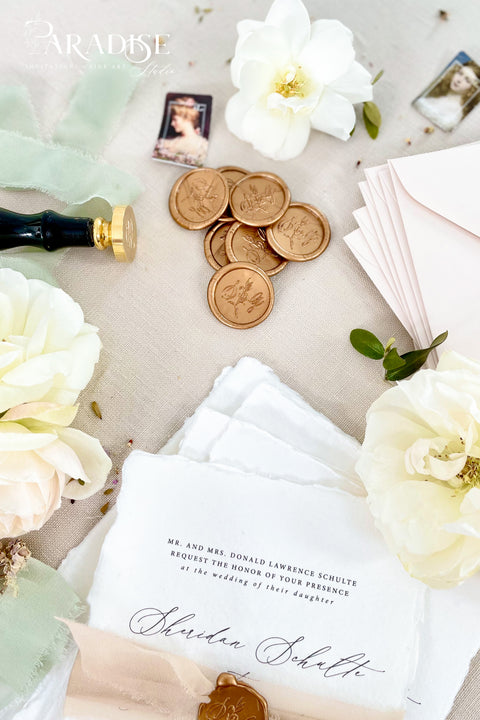 Elegant wax seals designed to elevate your wedding stationery with timeless detail. Each seal is hand-poured and finished to add a refined, heirloom-quality touch to envelopes, invitations, and day-of paper goods. Perfect for couples seeking a classic, romantic aesthetic with artisanal craftsmanship.&nbsp;Ideal for wedding invitations, save the dates, vow books, menus, and keepsake correspondence, these wax seals bring a sense of tradition and luxury to every detail.