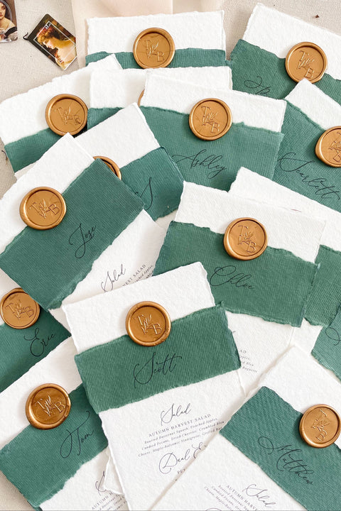 Elevate your wedding tablescape with our luxury handmade wedding menus, featuring deckled edges, silk paper belly bands, and wax seal accents. Each piece is crafted on fine cotton rag paper to create a timeless balance between elegance and texture - perfect for romantic, classic, or fine art celebrations. These menus blend craftsmanship and sophistication, turning every place setting into an unforgettable detail of your special day.