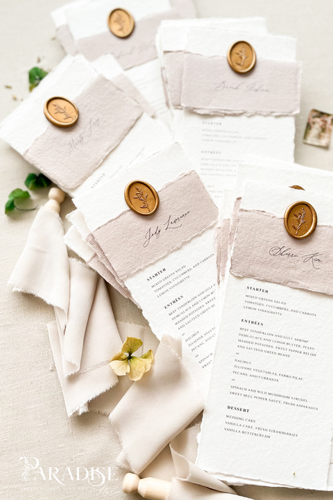 Elevate your reception with our handmade paper wedding menus, featuring taupe silk wraps and gold wax seals for a refined, organic-luxury look. Crafted from 100% cotton paper with deckled edges, these menus capture the essence of fine-art wedding design - romantic, tactile, and timeless. Perfect for elegant garden, rustic, or European-inspired celebrations.