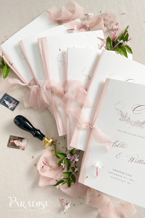 Designed for couples who love soft, feminine details, this wedding program features a gentle blush ribbon, subtle floral artwork, and beautifully balanced typography. The premium paper and delicate monogram create an elevated, cohesive look that enhances your ceremony styling. Thoughtfully crafted to feel both modern and timeless, it offers a graceful introduction to your most meaningful moments.