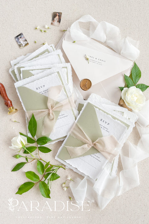 Celebrate your love story with our handmade deckled-edge wedding invitations, beautifully crafted with soft sage green accents, silk ribbon, and timeless wax seals. Each invitation is made by hand on luxurious 100% cotton paper, giving every piece an organic texture and an authentic fine art finish.