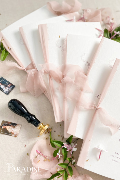 Designed for couples who love soft, feminine details, this wedding program features a gentle blush ribbon, subtle floral artwork, and beautifully balanced typography. The premium paper and delicate monogram create an elevated, cohesive look that enhances your ceremony styling. Thoughtfully crafted to feel both modern and timeless, it offers a graceful introduction to your most meaningful moments.