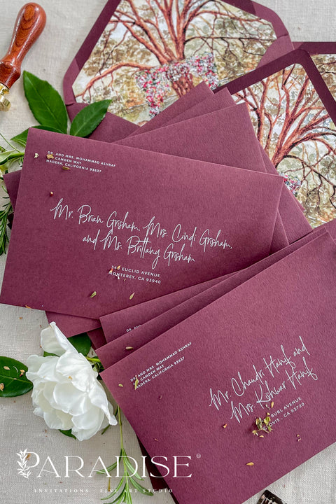 Burgundy wedding envelopes with white ink address printing, crafted from premium paper and styled to showcase rich color, smooth texture, and elegant typography.