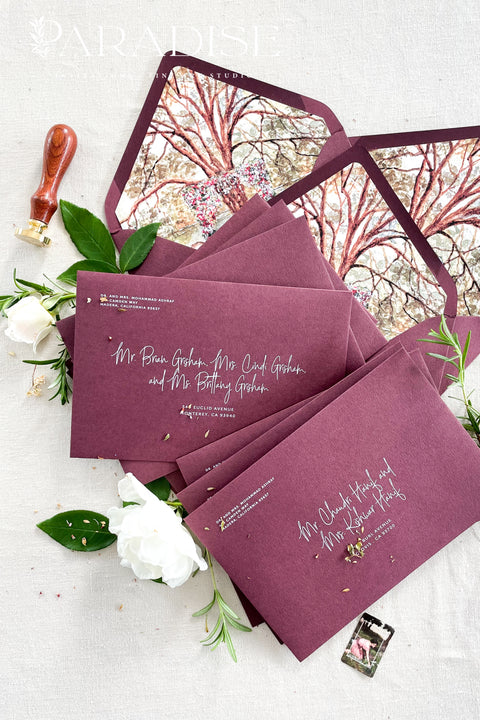 Burgundy wedding envelopes with white ink address printing, crafted from premium paper and styled to showcase rich color, smooth texture, and elegant typography.