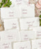 Bring soft elegance to your tablescape with our handmade paper place cards, crafted from luxurious cotton rag paper and finished with naturally torn deckled edges. Each card features romantic calligraphy paired with a delicate floral illustration, creating a fine-art aesthetic perfect for weddings, showers, intimate dinners, and elevated celebrations. These artisan-crafted pieces add organic texture, timeless beauty, and refined charm to any event setting.