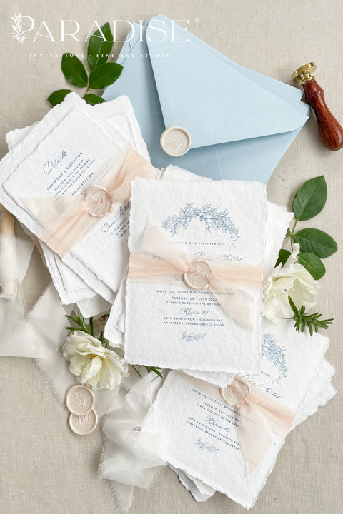 Announce your seaside celebration with these beautifully crafted handmade paper wedding invitations. Perfect for a beach wedding, this suite combines a relaxed, coastal feel with the refined elegance of artisan cotton rag paper. Each invitation features a delicate botanical design that evokes the natural beauty of the shoreline, from swaying palms to coastal foliage. The unique, deckled-edge paper adds a rustic, organic texture that is perfectly suited for a romantic oceanfront ceremony.