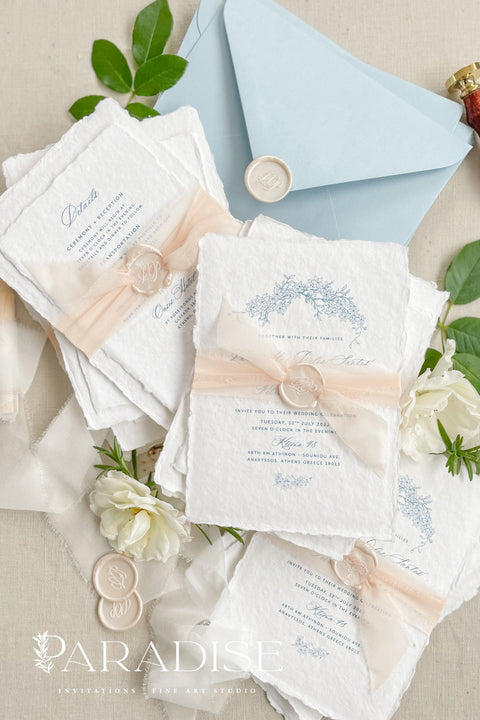Announce your seaside celebration with these beautifully crafted handmade paper wedding invitations. Perfect for a beach wedding, this suite combines a relaxed, coastal feel with the refined elegance of artisan cotton rag paper. Each invitation features a delicate botanical design that evokes the natural beauty of the shoreline, from swaying palms to coastal foliage. The unique, deckled-edge paper adds a rustic, organic texture that is perfectly suited for a romantic oceanfront ceremony.